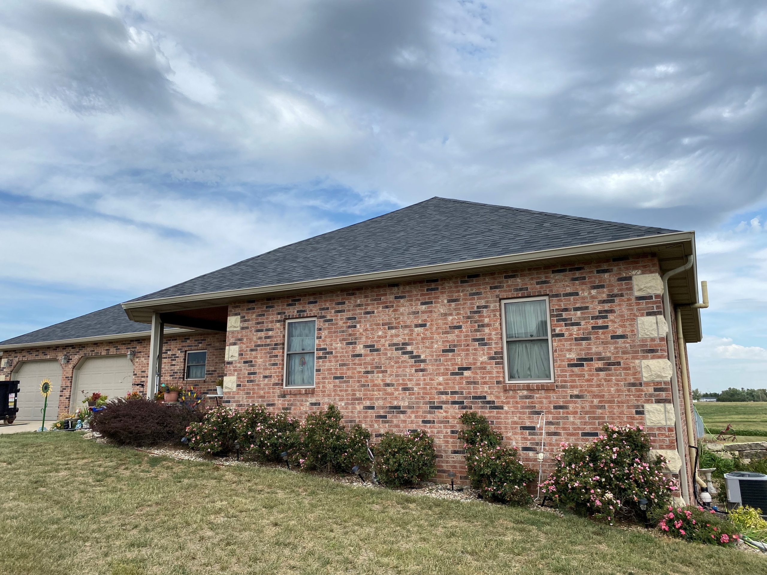 Buck Roofing adds new gutters and Malarkey Legacy shingles to house