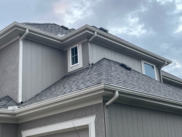 New shingles and gutters added to a house in Kansas City